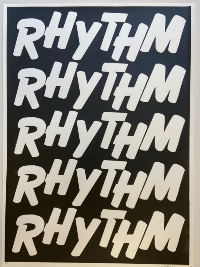 Rhythm Print. A print with a black background. The design is ‘RHYTHM’ written five times in a stylish and casual all-caps font.
