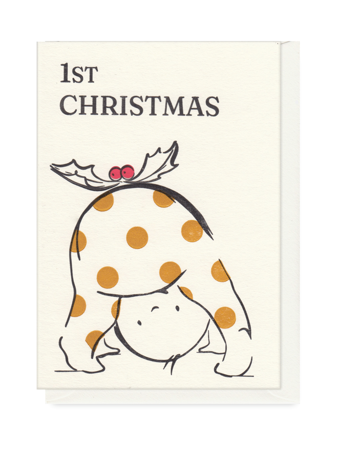 1st Christmas greeting card for baby.  Simple design with cute baby character in spotty baby-grow being a christmas pudding.