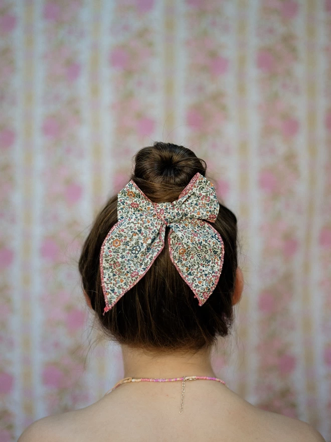 Girl with brown hair and beautiful liberty bow