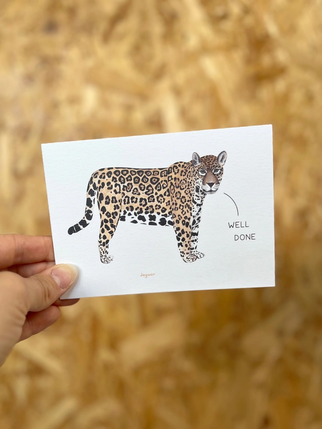  a greetings card featuring an illustration of a jaguar with the text “well done”