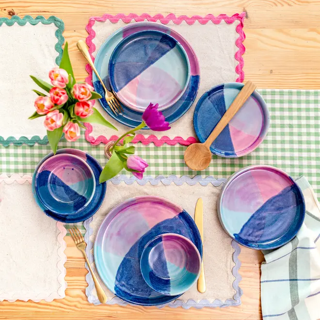 Landscape Pasta Bowl, a table setting with colourful pasta bowls, cutlery and colour napkins. 