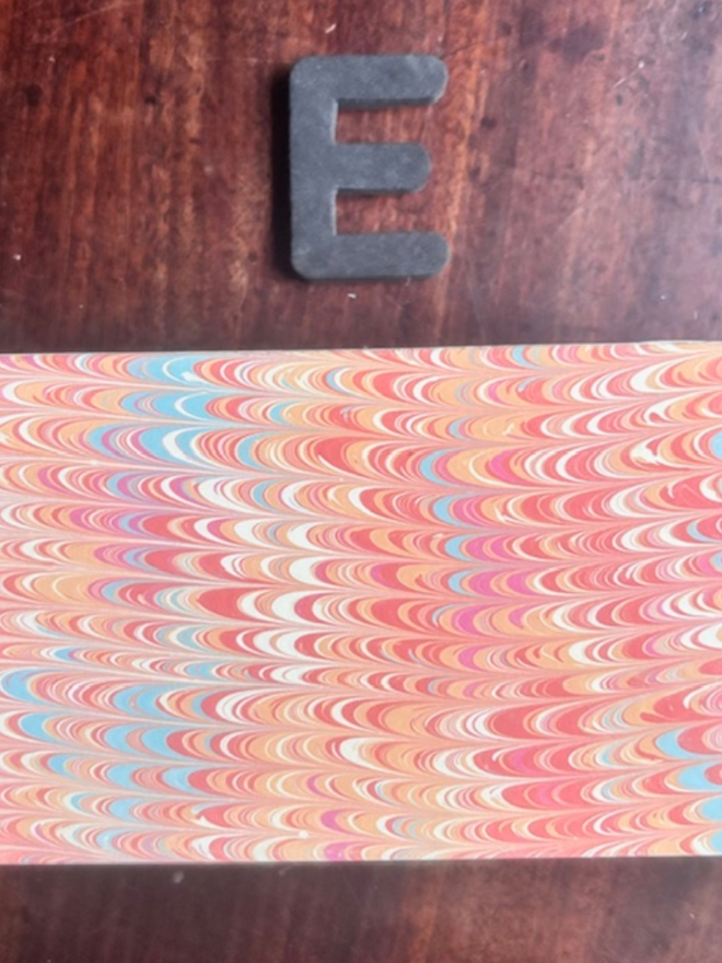 Matchbox Cover. A matchbox cover in E