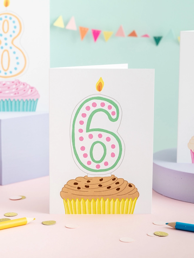 A sweet sixth birthday card featuring a cupcake and candle