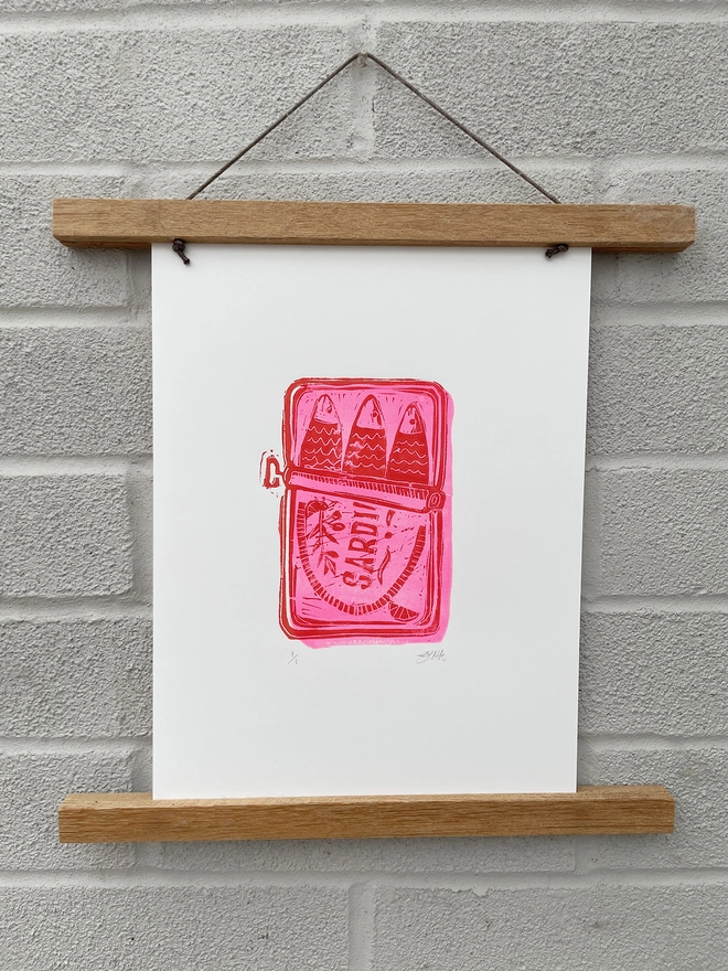 Neon Pink hand printed lino print A4 on grey wall