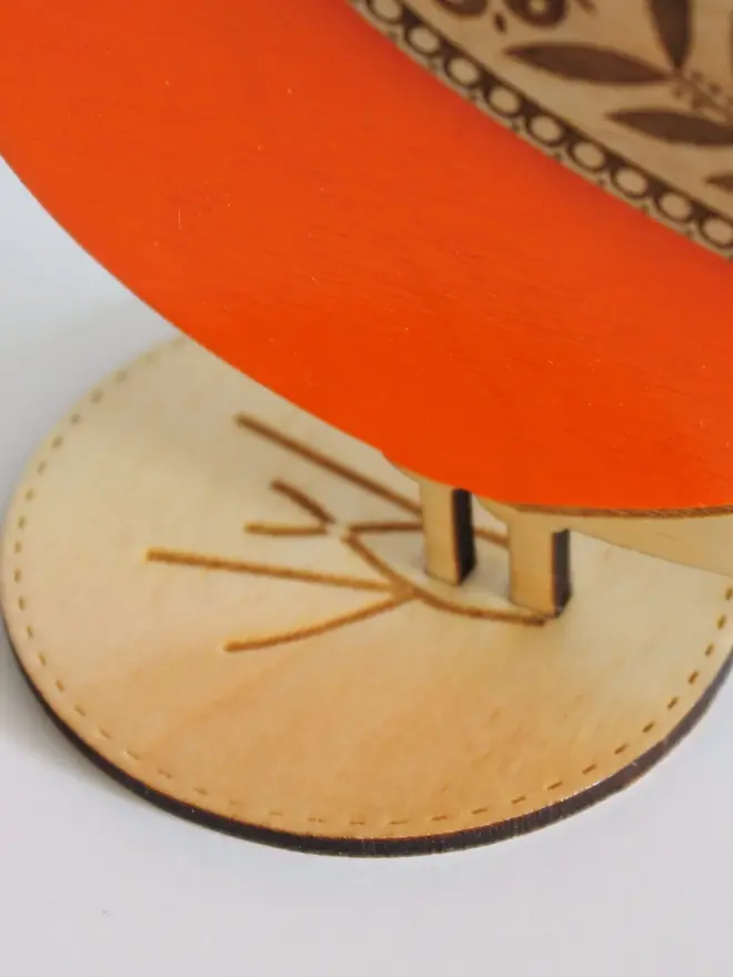 Standing Wooden BullFinch,Standing Wooden BullFinch, orange wooden bird decoration standing on a platform. 