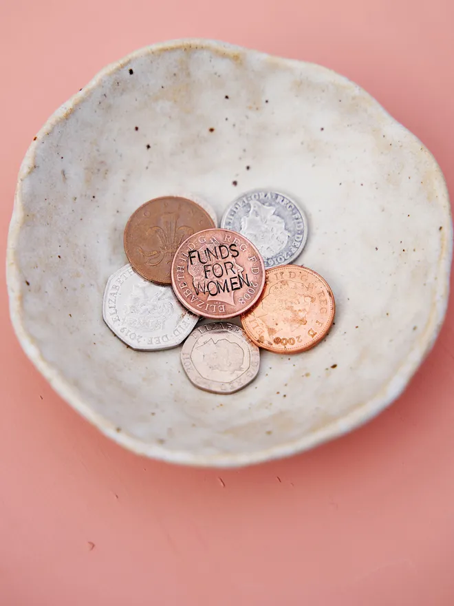 'Funds For Women' Stamped Coin