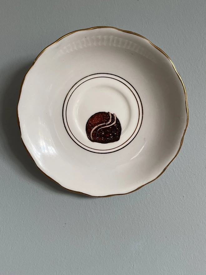 almond chocolate painting on vintage saucer