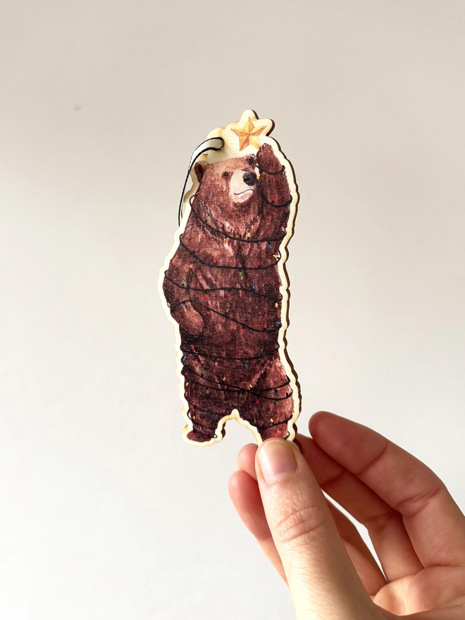 Bear Christmas decoration in hand