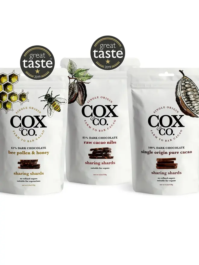 Cox&Co Sharing Shards Pouch - Bee Pollen & Honey, a group of shard pouches sitting on a table surface. 