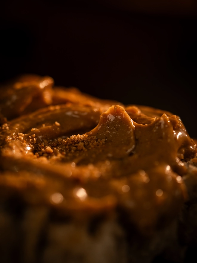 Yellow nutty spread on a bread close up 