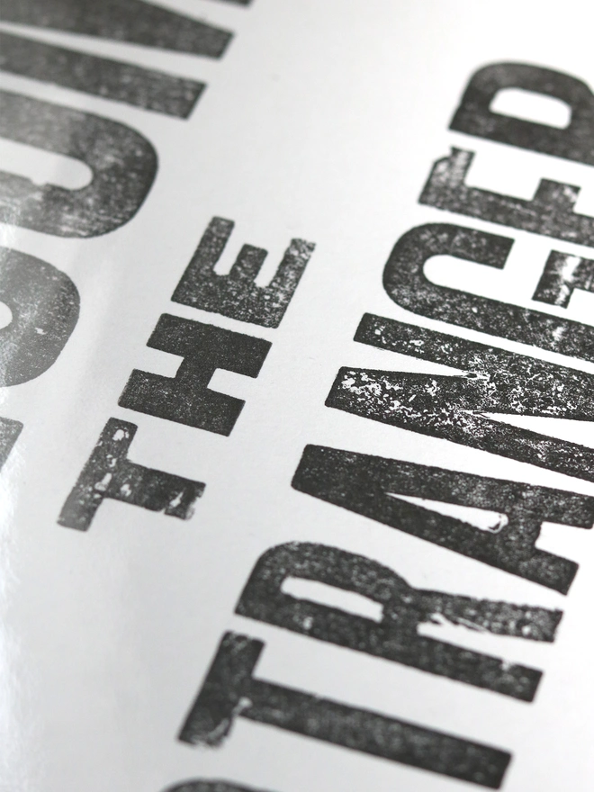 Original letterpress poster featuring the words 'Love your neighbour, welcome the stranger'