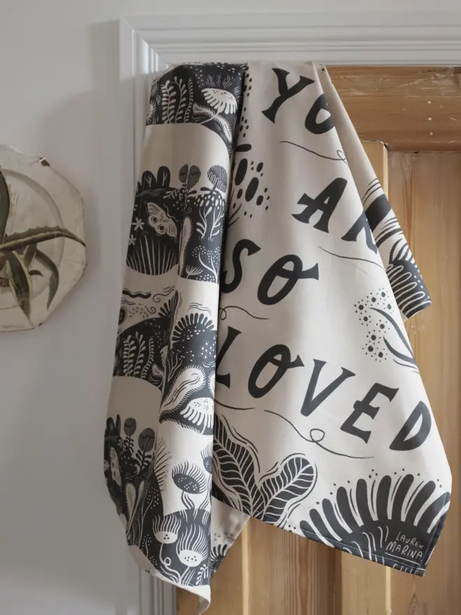 Decorated monochrome tea towel