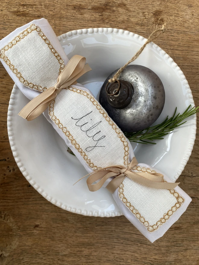 Fabric Cracker Napkin Decoration on plate with bauble