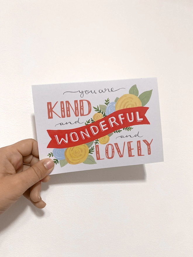 Kind card image in hand