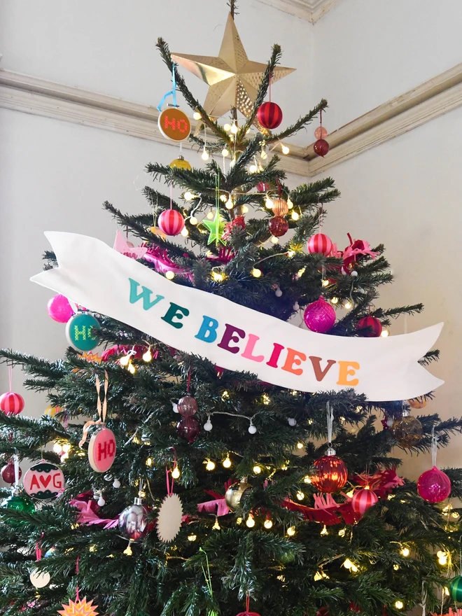 We Believe christmas tree banner.