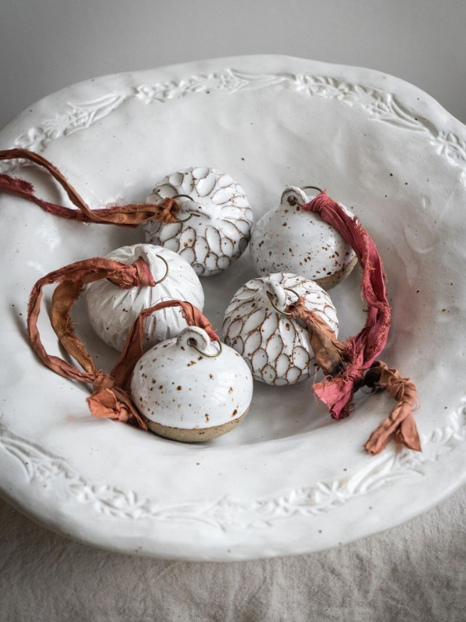 Hand carved Christmas baubles