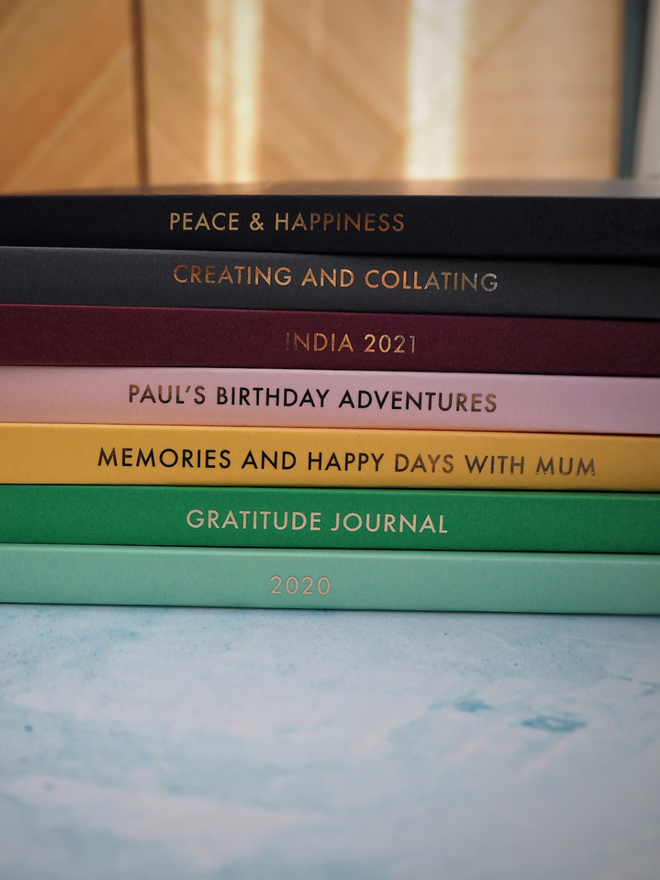 personalised gold foil a5 notebook. coloured notebooks with gold personalisation on the spine.