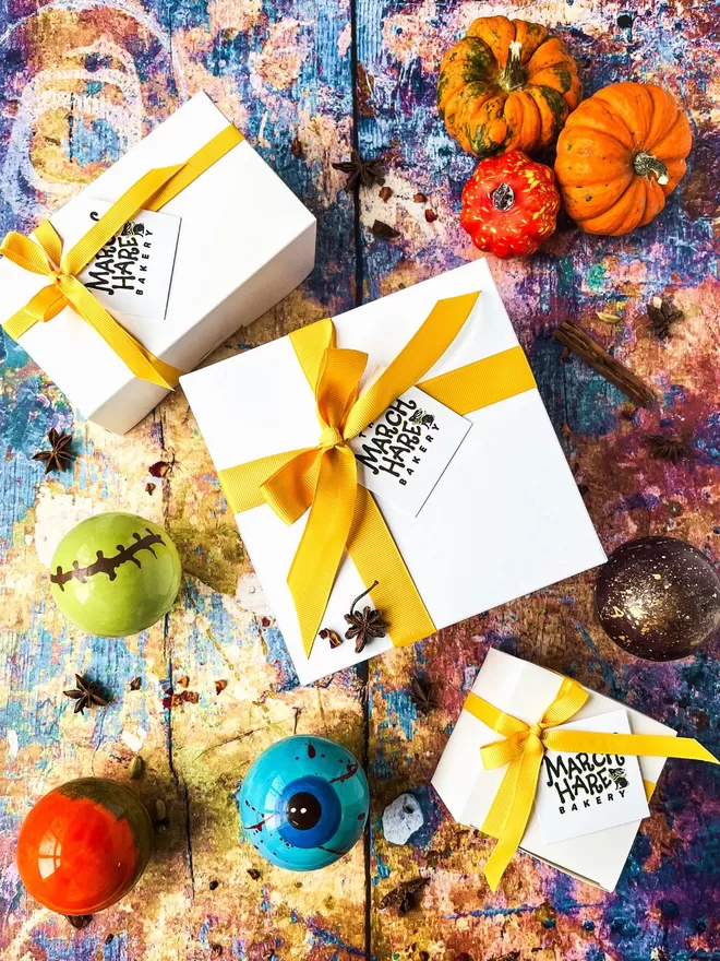 four halloween chocolate balls in a gift box