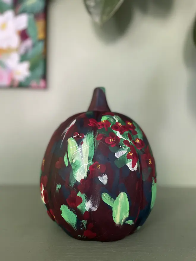 hand painted ceramic halloween autumn pumpkin deep red with vibrant red quince flowers