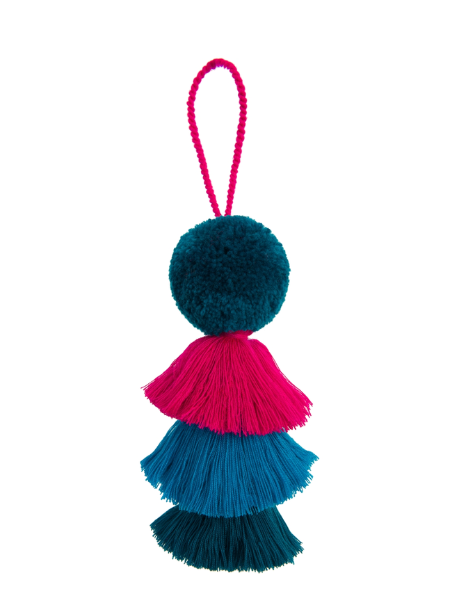 pom pom and tassel swag hanging decoration. a hanging decoration in regal blue and pink colours.