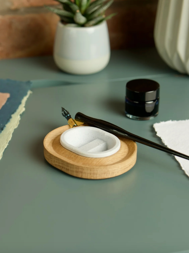 Versatilt Ink Stand. An ink stand in Marble White, empty.