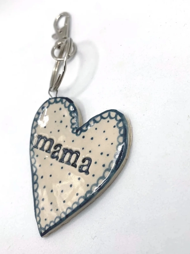 Mama Heart Ceramic Keyring, a blue keyring sitting on a plain white surface. 