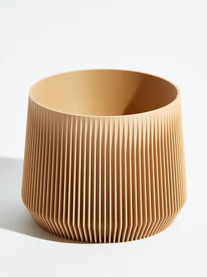 Sustainable 3D Printed ​​Sand Beige Plant Pot, pillar design, against a white background.