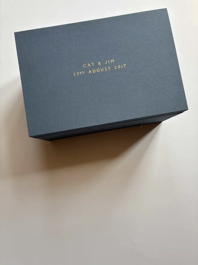 Exterior of a wedding keepsake box in Steel Blue book cloth with gold foiled lettering