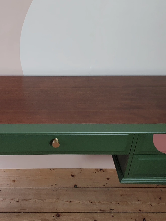 Refinished mahogany desk top painted green and pink