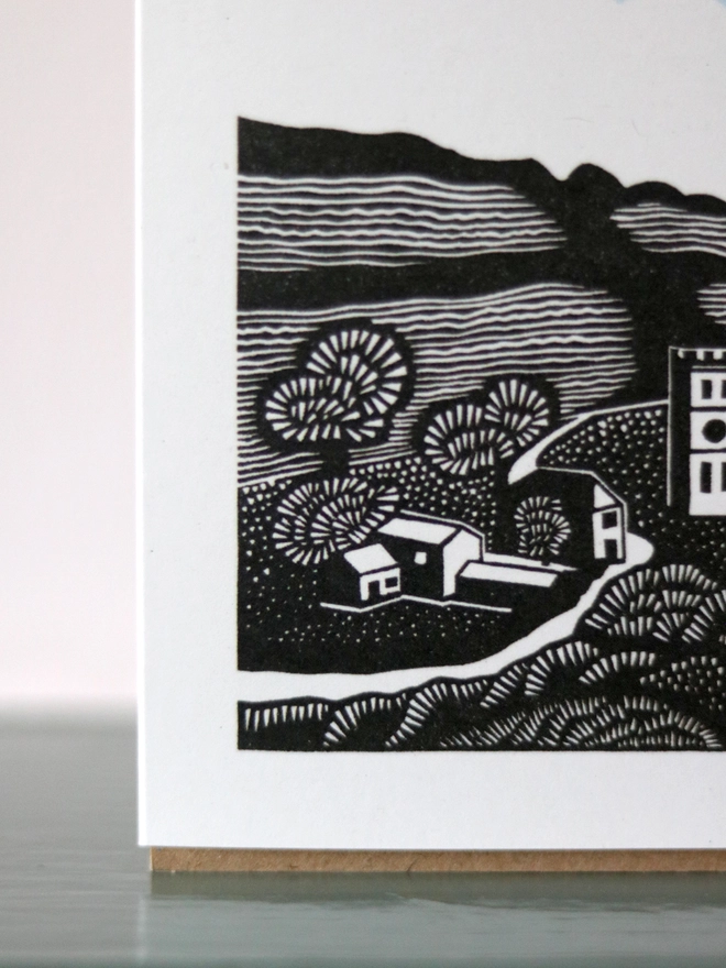 Greetings card featuring a linocut design of a Cornish village landscape premium card 100% recycled