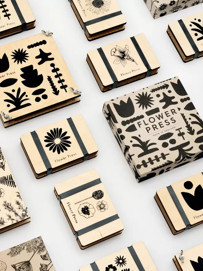 Flat lay of different Flower Press designs available from Studio Wald.
