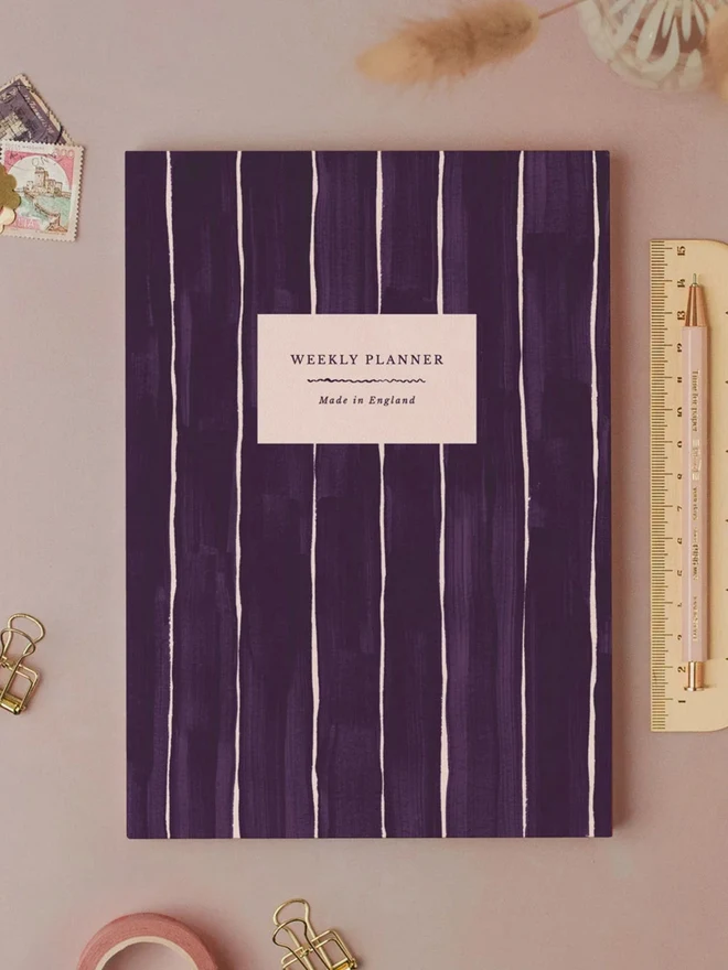 Pinstripe Weekly Planner by Sister Paper Co with a hand-painted purple pinstripe cover