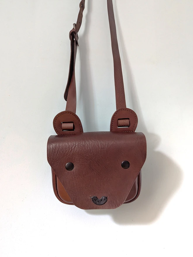 hanging handmade brown kids bear cross- body bag, front view