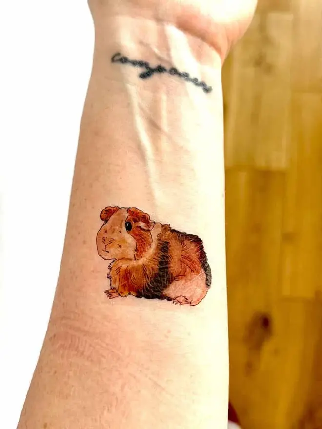 Pets Temporary Tattoos, an arm showing temporary tattoos of a guinea pig.