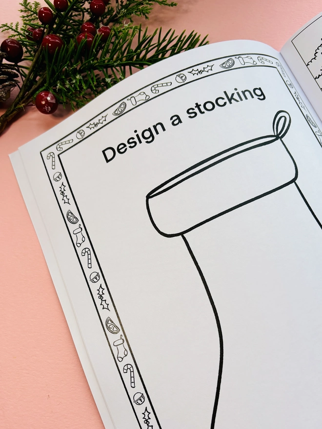 Christmas activity book with festive stocking decorating page
