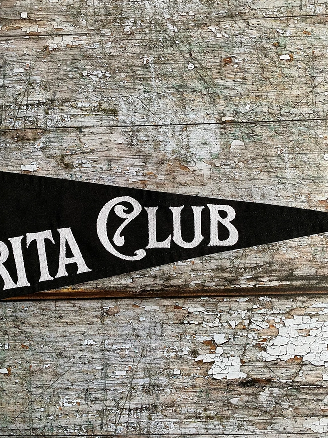 Black flag white writting Midnight Margarita Club Practical Magic