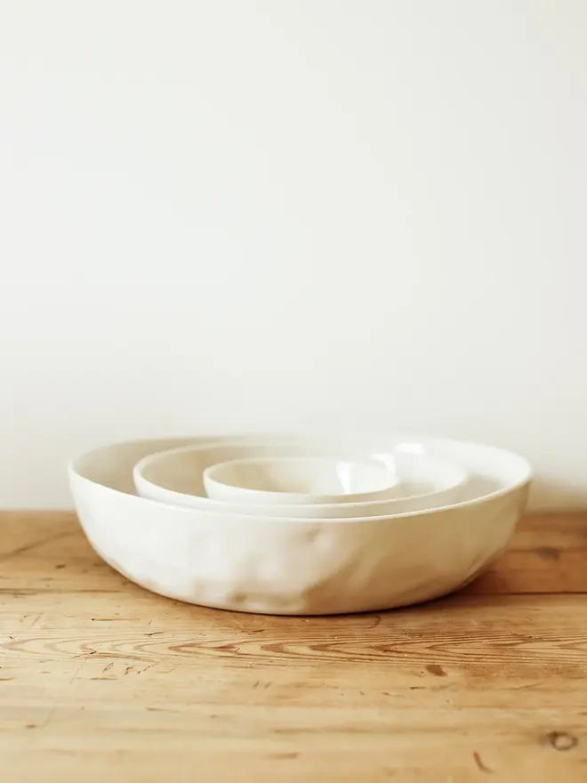 'milk' handcrafted stoneware bowl. a set of three white serving bowls.