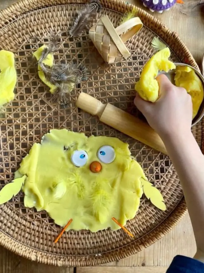 child playing with Easter chick play dough kit