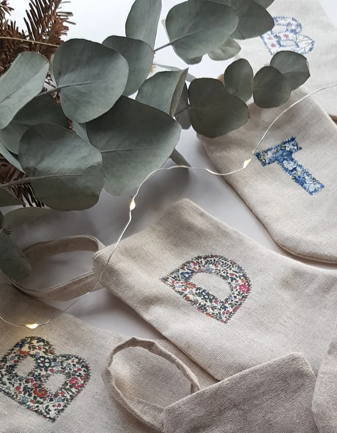 Floral Linen Christmas Stocking. Natural Linen Stocking with floral letter