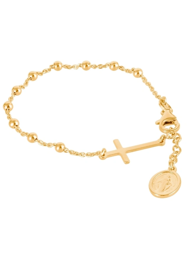 Gold rosary bead bracelet on white