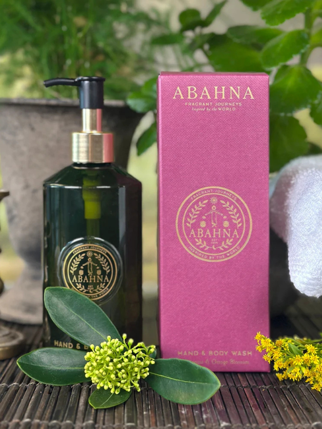 frangipani and orange blossom hand and body wash. a green pump bottle and pink box containing natural hand and body wash.