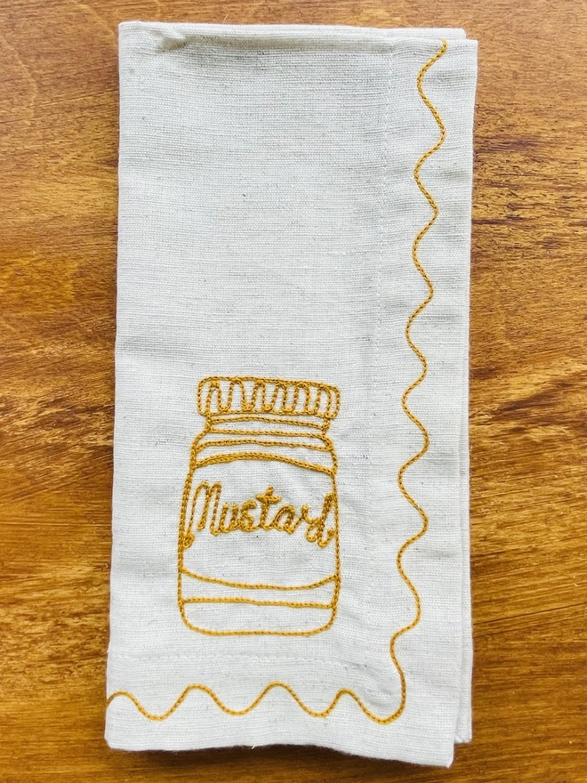 mustard embroidered napkin