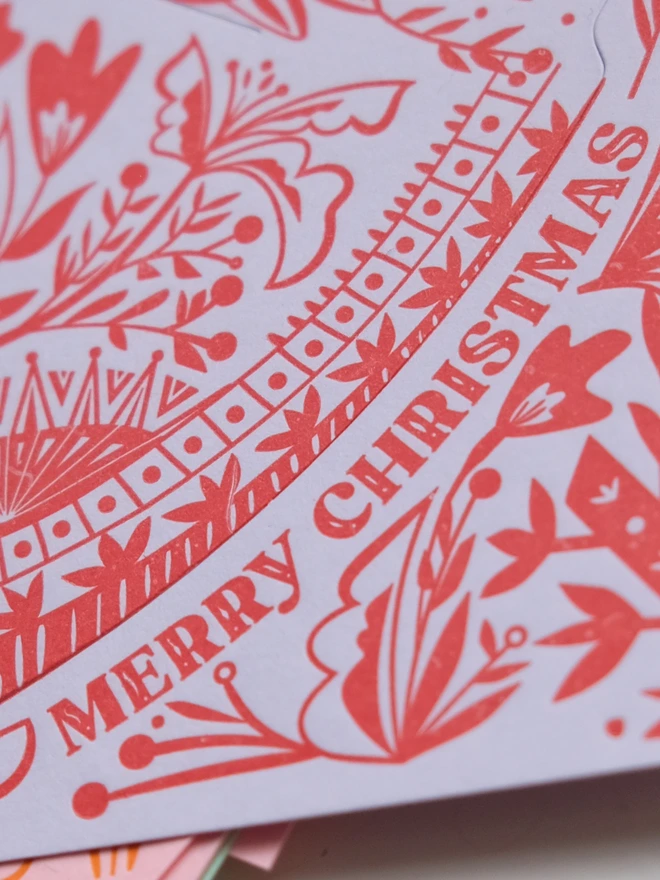 'Merry Christmas' text detail on Angel card. 