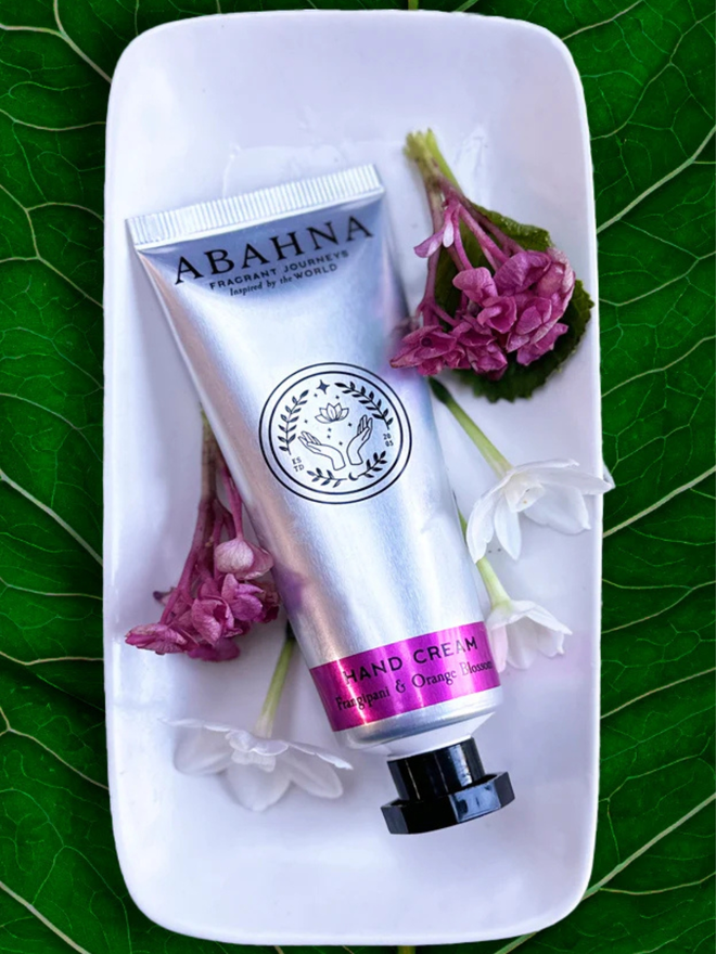 frangipani and orange blossom botanical hand cream. a silver tube containing hand lotion.