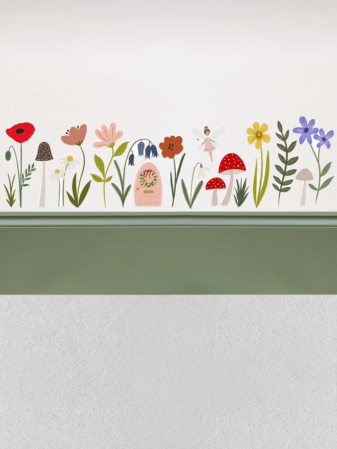 Fairy Door and Forest Flower wall stickers above dark mossy green painted skirting board