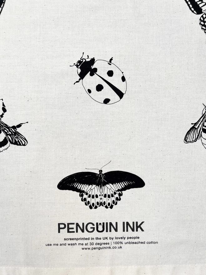 Close up of the Penguin Ink logo with the lovely insects illustrations around it