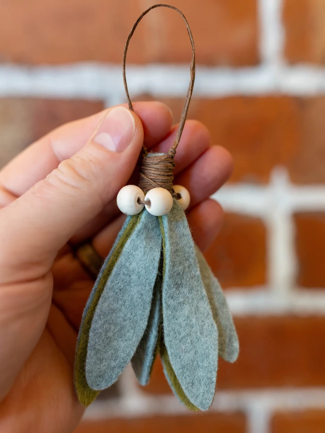 felt mistletoe decoration with white wooden beads