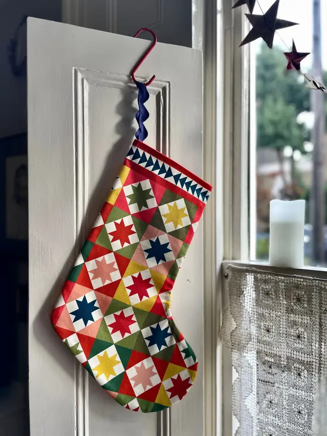 Lyra Organic Printed Stocking, hanging. 