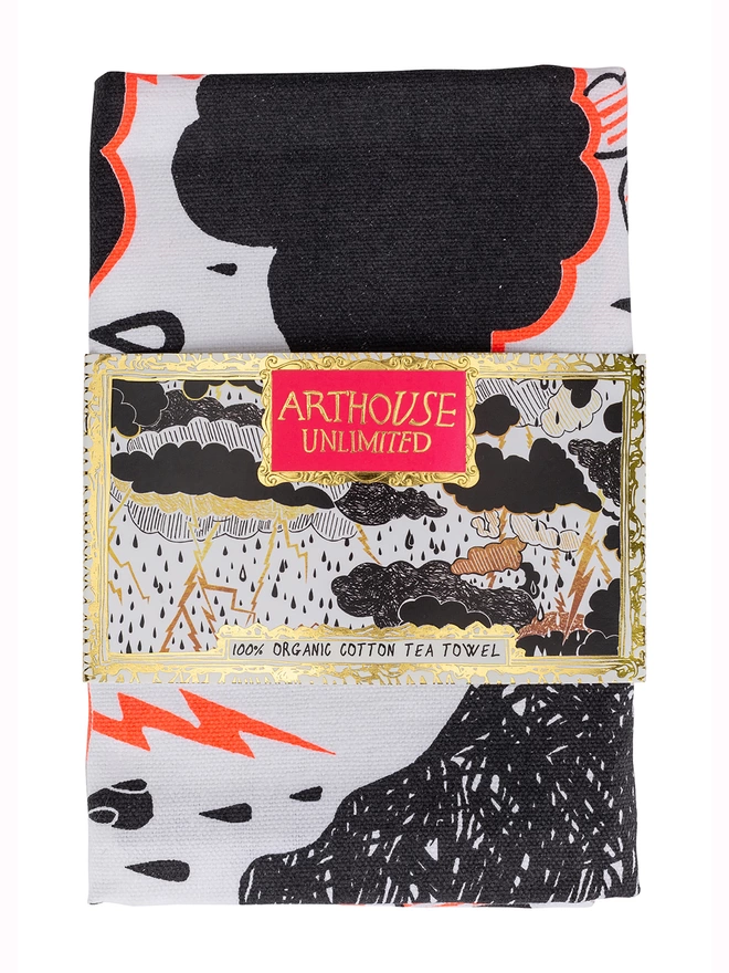 Close up of rumble 100% organic cotton charity tea towel featuring black & orange clouds & lightening