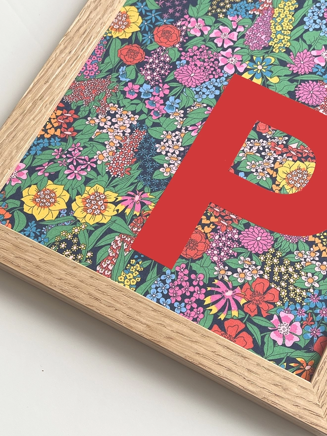 Personalised framed red initial on Liberty Ciara fabric - close up